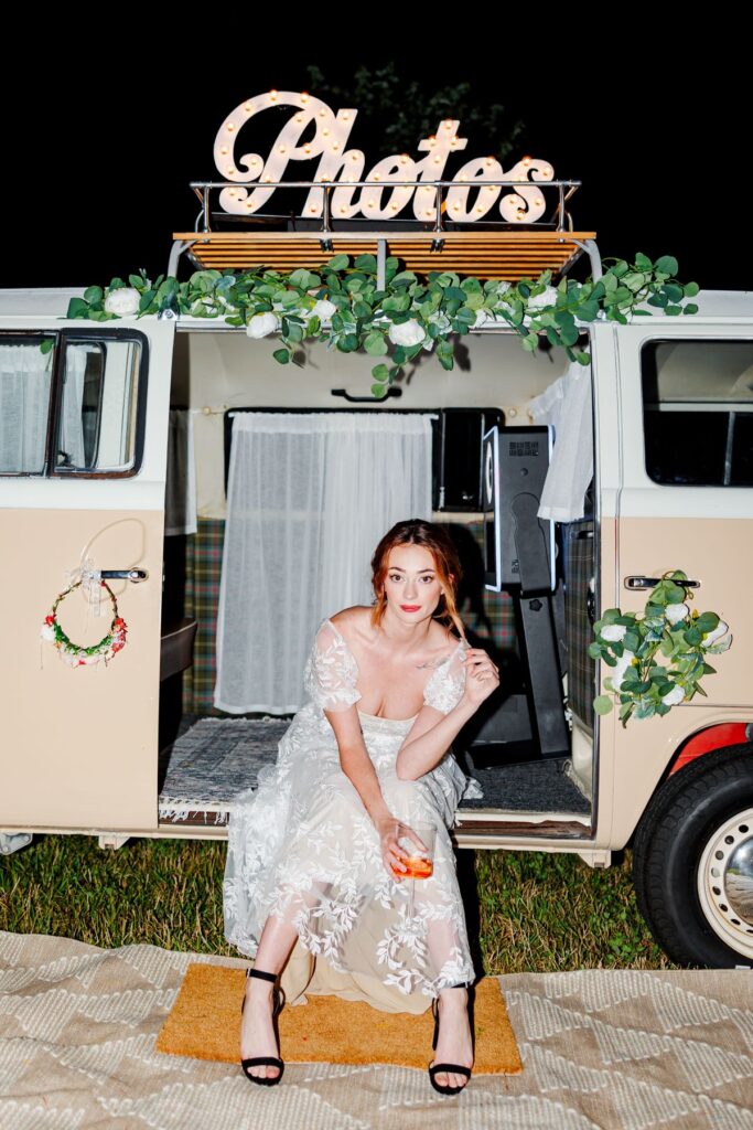 Bride sitting on photo bus